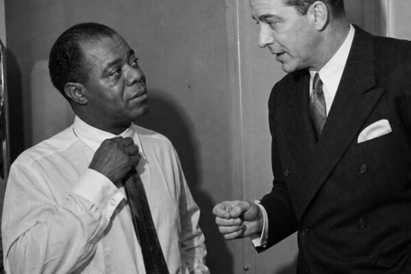 One Man Controlled Louis Armstrong’s Career for 34 Years. Armstrong Called Him Family. D